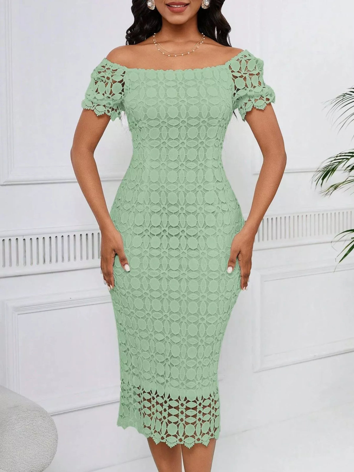 Sage green short-sleeve lace midi dress with slit, front view.