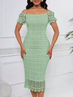 Sage green short-sleeve lace midi dress with slit, front view.