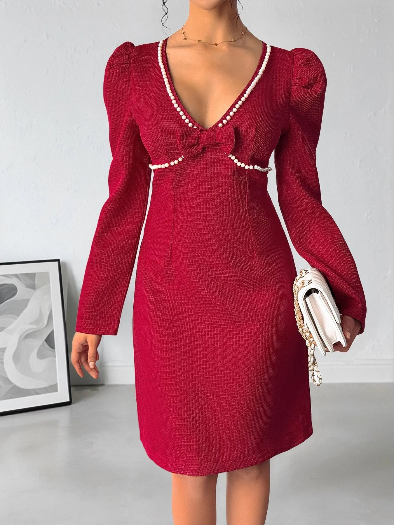 Pearl trim V-neck dress detail