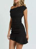 Black one-shoulder ruffle-hem mini dress, front view.
