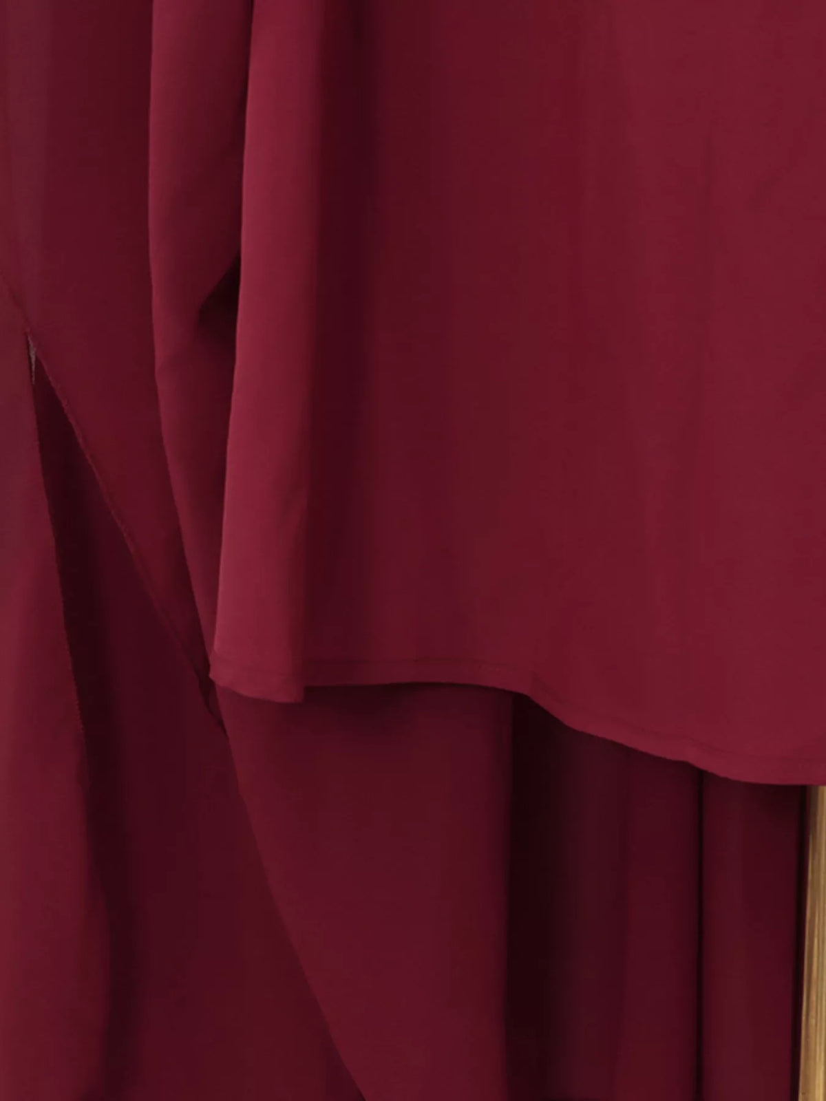Burgundy ruched halter cape maxi dress, lining detail.