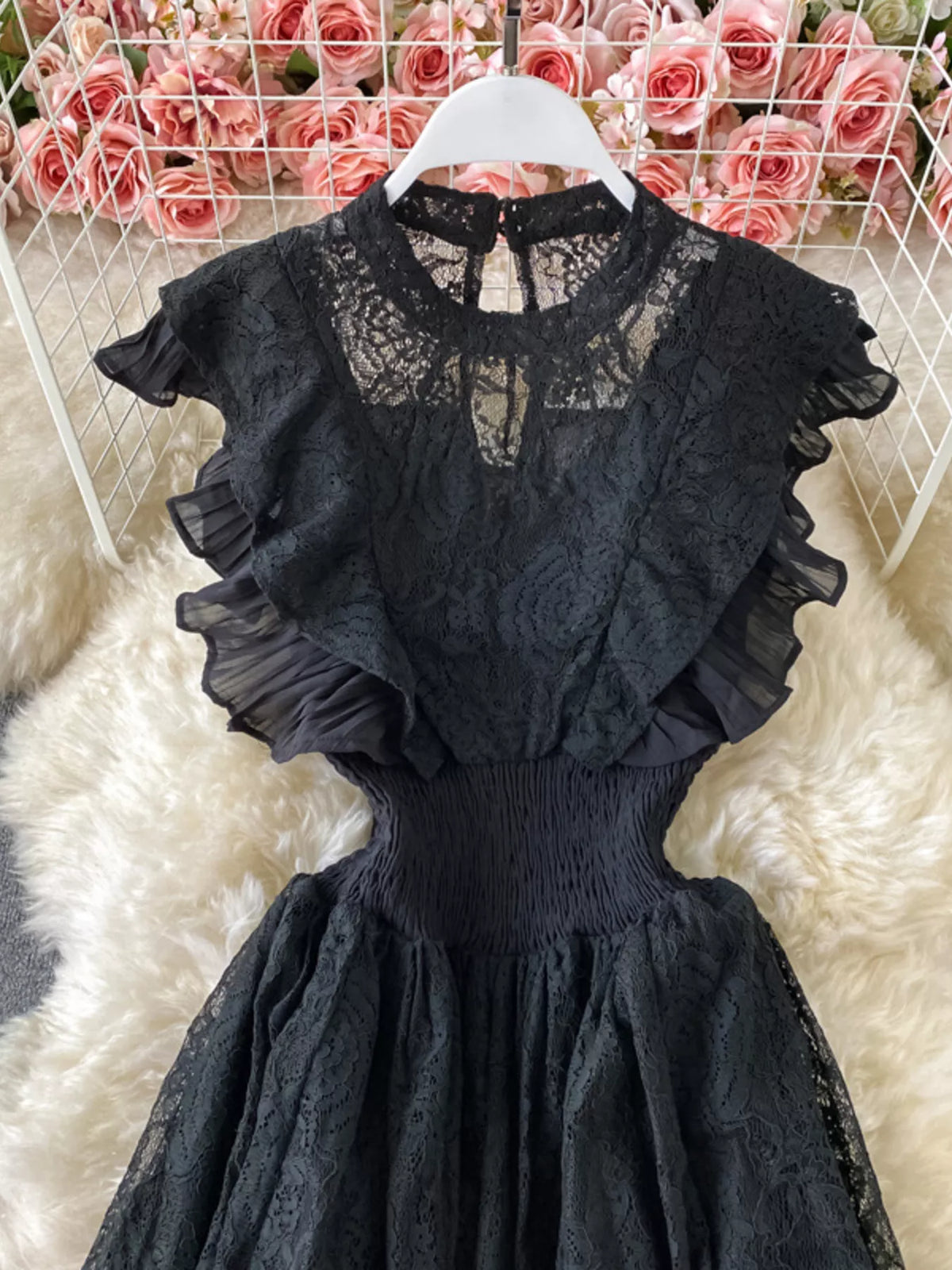Black ruffled mock-neck lace maxi dress, bodice detail.