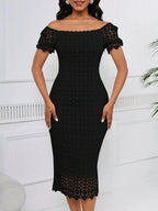 Black short-sleeve lace midi dress with slit, front view.