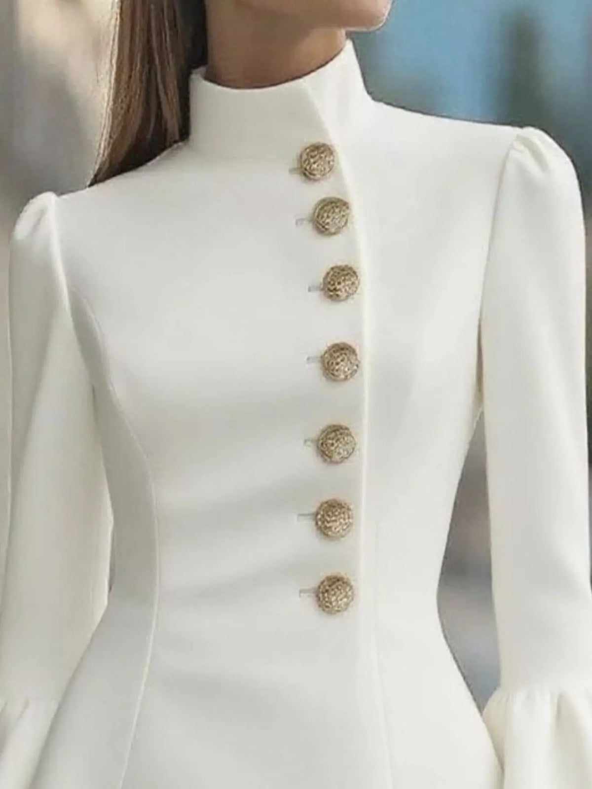 Ivory ruffled bell-sleeve mini dress, neckline detail.