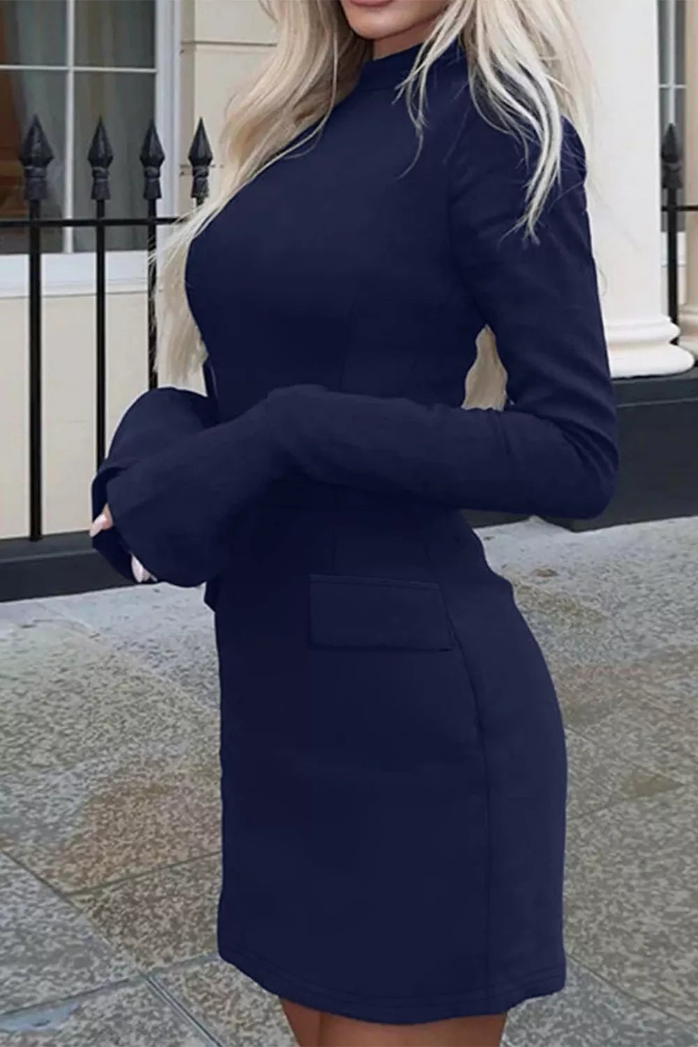 Navy button-front long-sleeve mini dress, side view.