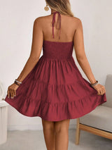 Burgundy smocked halter tiered mini dress, back view