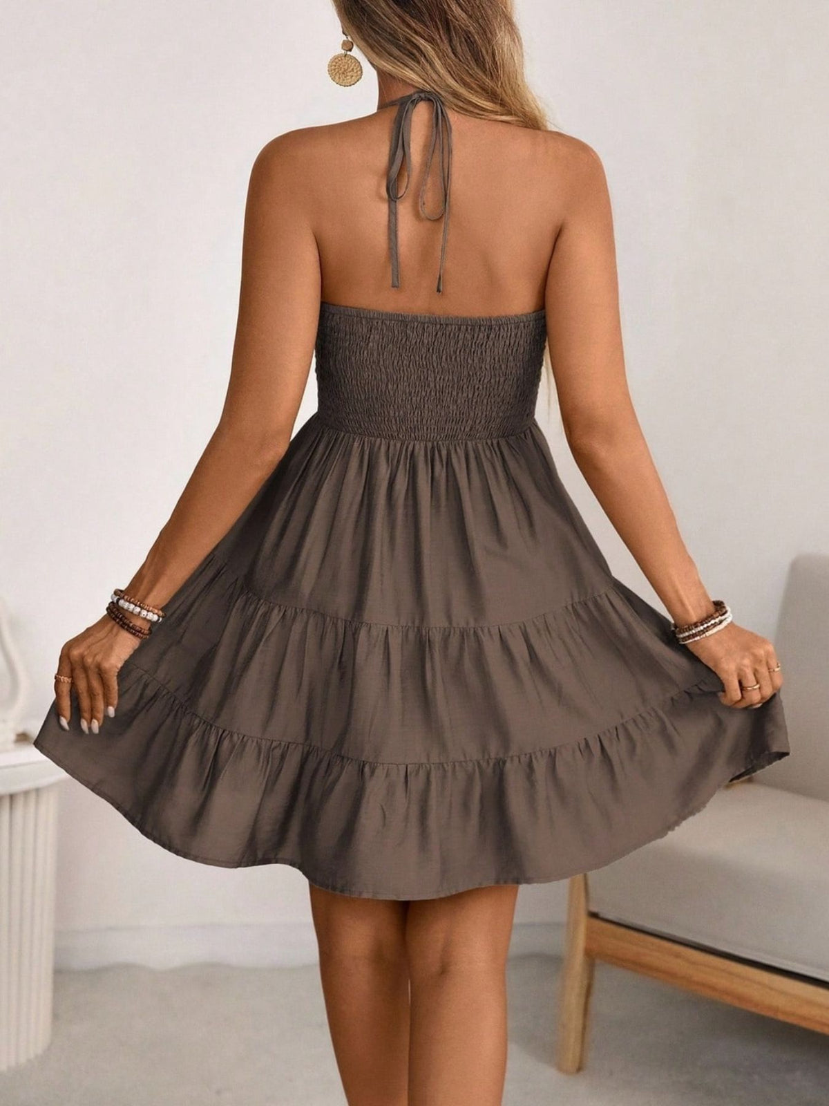 Brown smocked halter tiered mini dress, back view