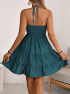 Teal smocked halter tiered mini dress, back view