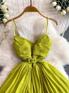 Lime green pleated layered spaghetti-strap midi dress, bodice detail.