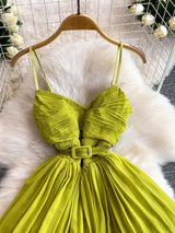 Lime green pleated layered spaghetti-strap midi dress, bodice detail.