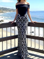 Black rhinestone sheer off-shoulder maxi dress, front view.