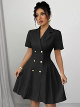 Black double-breasted pleated blazer mini dress, front view.
