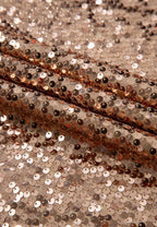 Gold-tone sequin dress fabric close-up