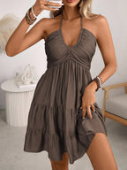 Brown smocked halter tiered mini dress, front view