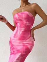 Pink printed strapless side-slit maxi dress, neckline detail.