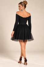 Black pearl-trim off-shoulder mini dress, back view.