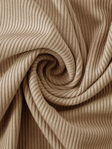 Beige ribbed dress fabric close-up