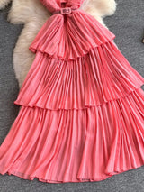 Pink pleated layered spaghetti-strap midi dress, skirt detail.