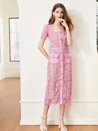 Pink lace button-up midi dress with pockets, front view.
