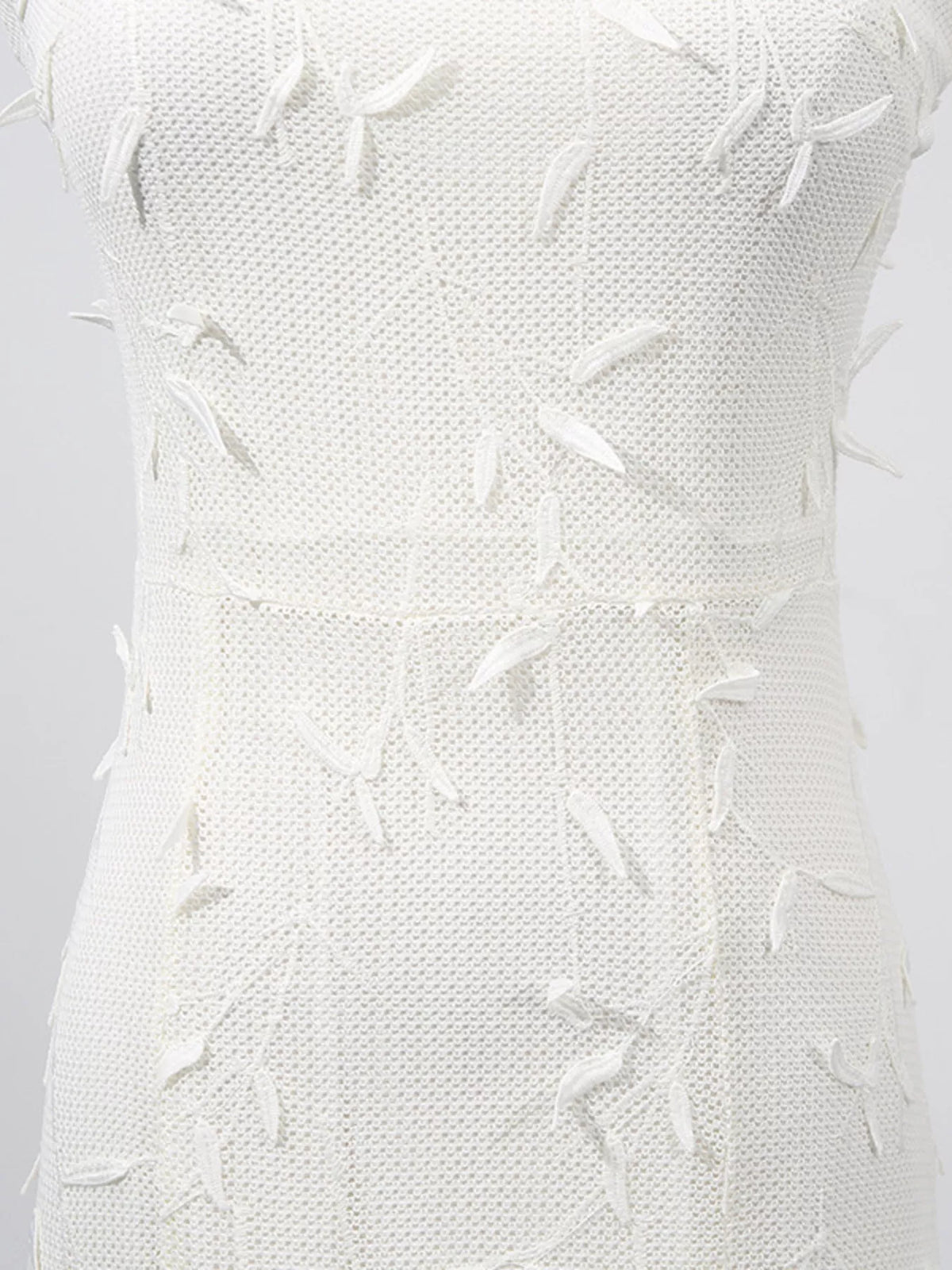 White sleeveless floral appliqué midi dress, fabric close-up.