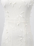 White sleeveless floral appliqué midi dress, fabric close-up.