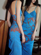 Blue floral thin-strap maxi dress, back view