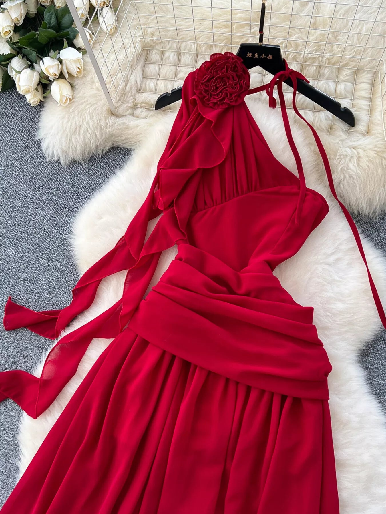 Red formal dress with floral shoulder detail