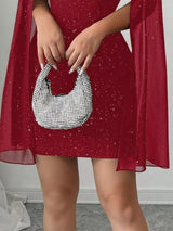 Red glitter cutout bodycon mini dress with cape sleeves, skirt detail.