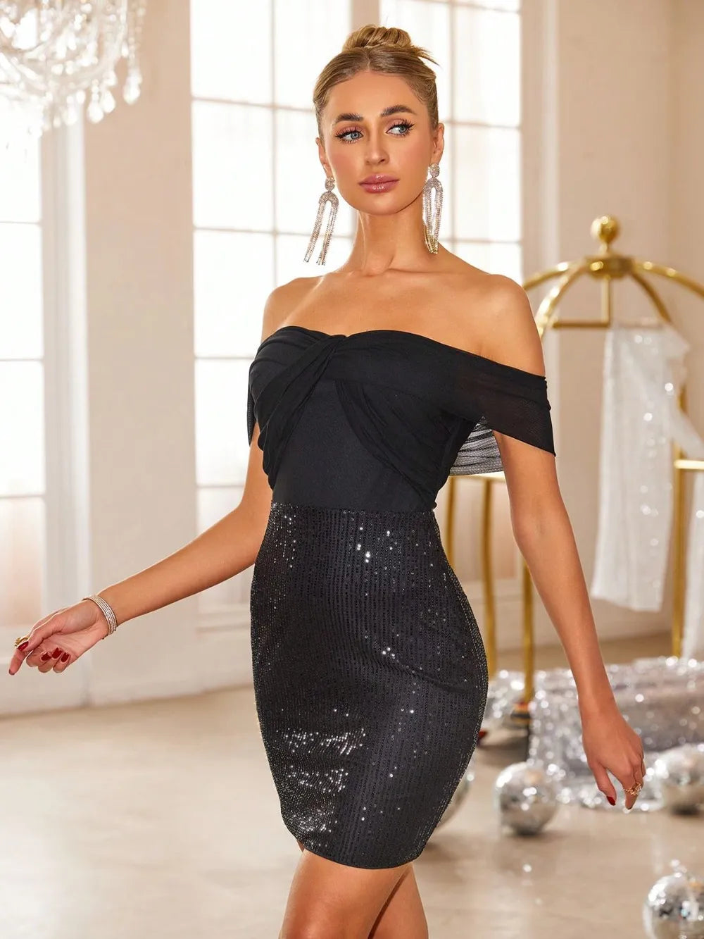 Black off-shoulder sequin mini dress, front view