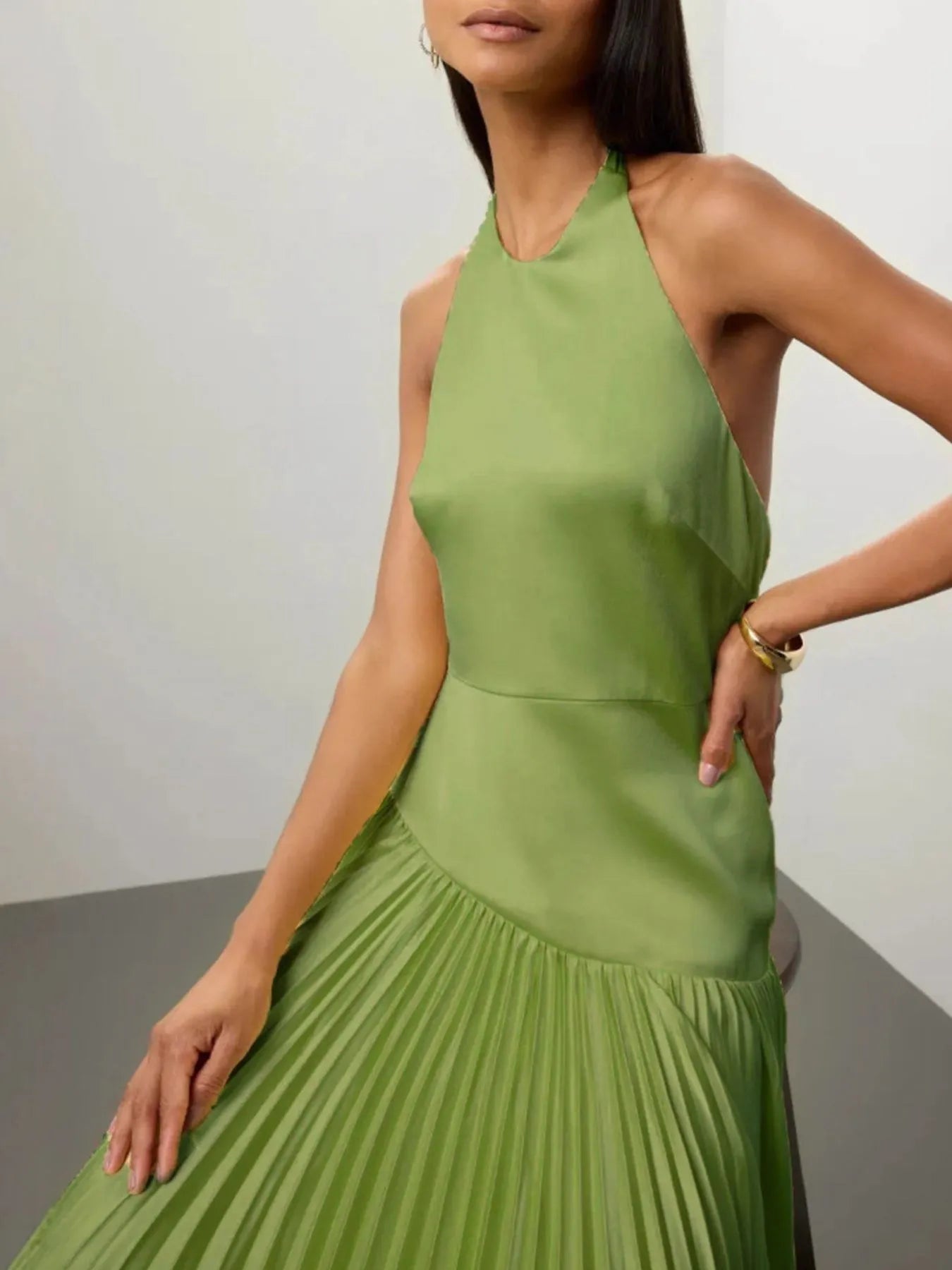 Pleated halter-neck maxi dress flowing silhouette