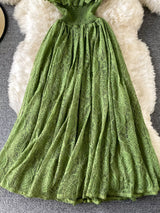 Green ruffled mock-neck lace maxi dress, skirt detail.