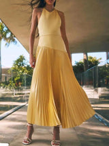 Yellow pleated halter-neck maxi dress, front view.