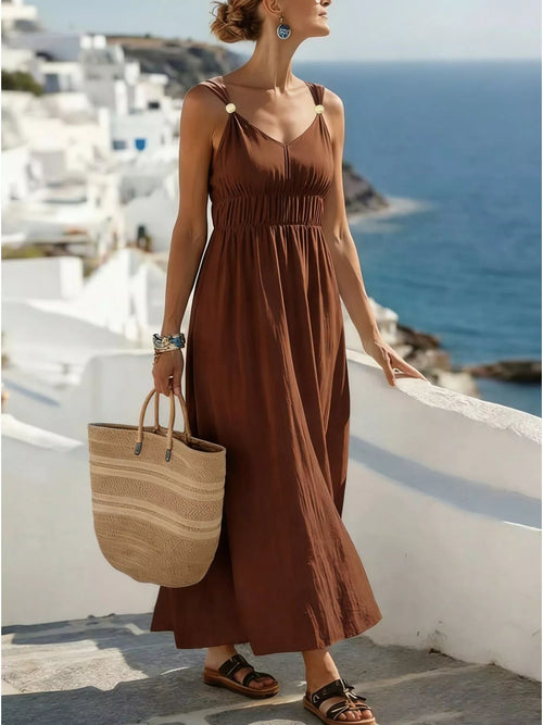 Brown ruched v-neck maxi dress, front view.