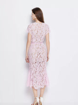 Pink short-sleeve lace mermaid midi dress, back view.