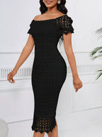 Black short-sleeve lace midi dress with slit, front view.