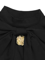 Black mock-neck long-sleeve mini dress, neckline detail.