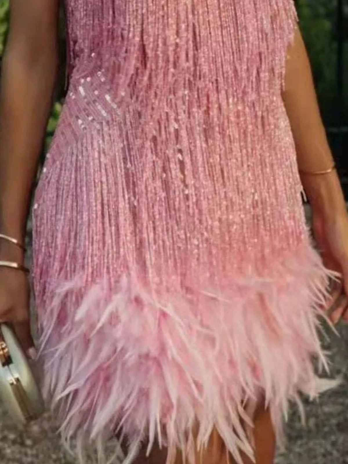 Pink plus-size sequin feather-fringe mini dress, hem detail.