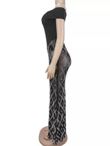 Black rhinestone sheer off-shoulder maxi dress, side view.
