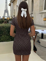 Black polka dot polka dot cutout tie-front mini dress, back view.