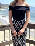 Black rhinestone sheer off-shoulder maxi dress, neckline detail.