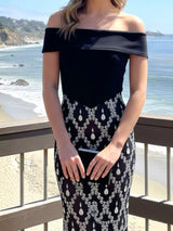Black rhinestone sheer off-shoulder maxi dress, neckline detail.