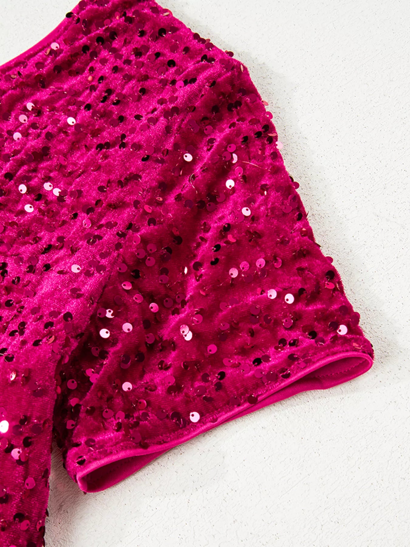 One-shoulder sequin dress detail