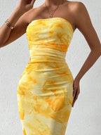 Yellow printed strapless side-slit maxi dress, neckline detail.