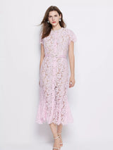 Pink short-sleeve lace mermaid midi dress, front view.