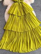 Lime green pleated layered spaghetti-strap midi dress, skirt detail.