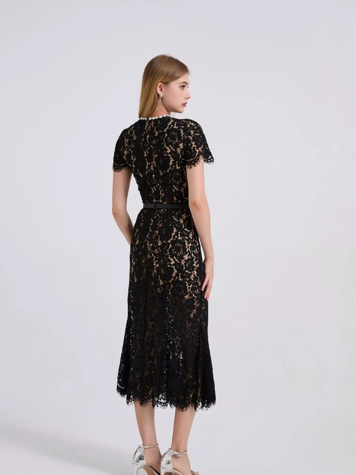 Black short-sleeve lace mermaid midi dress, back view.