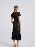 Black short-sleeve lace mermaid midi dress, back view.