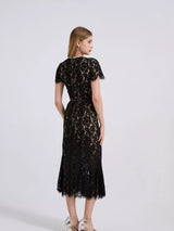 Black short-sleeve lace mermaid midi dress, back view.