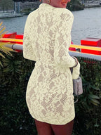 Pale yellow lace cutout long-sleeve mini dress, back view.