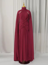 Burgundy ruched halter cape maxi dress, front view.
